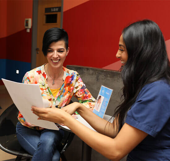 Coordinator reviewing a diagnostic report with a patient